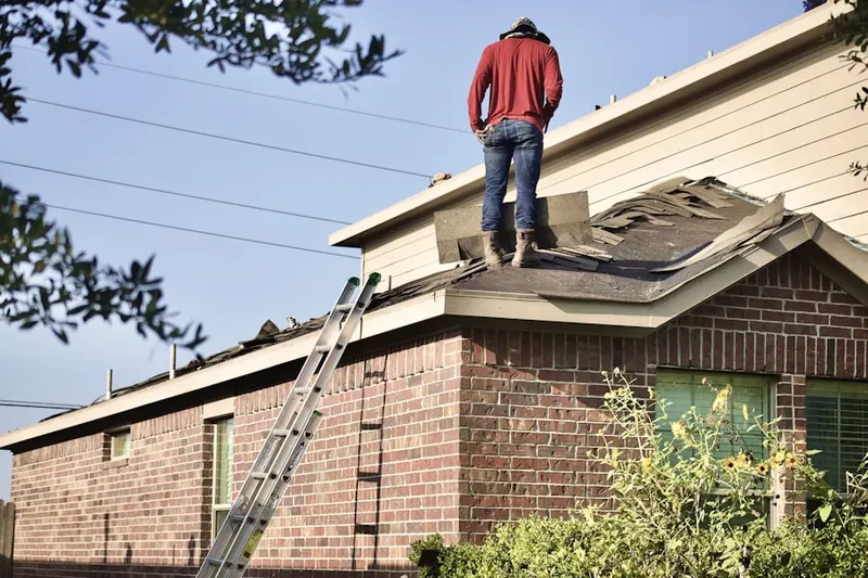 Professional roofer working on a residential roof in Arlington Heights